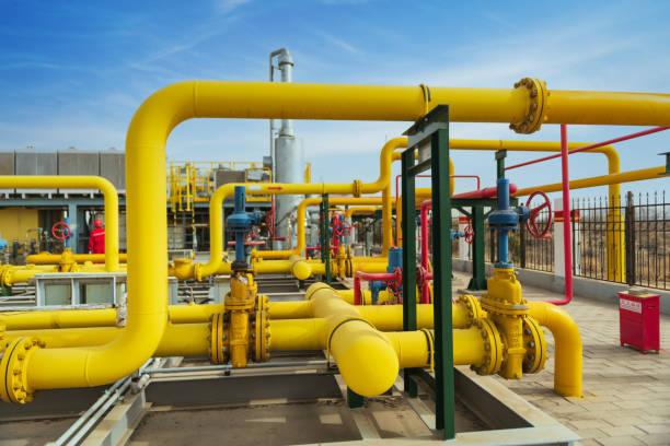 Blue pipeline valves at sunset